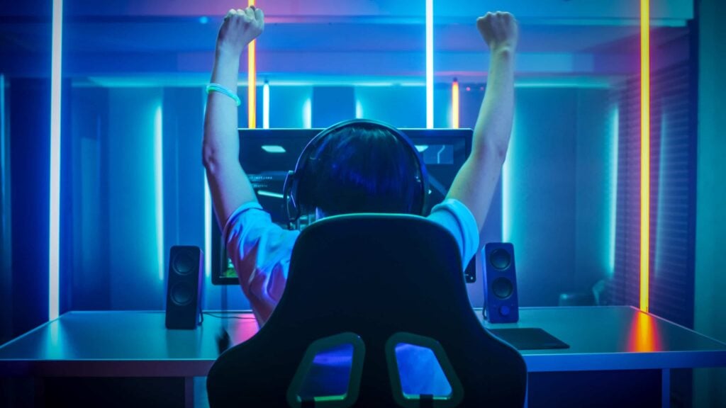 Gamer celebrating win while using gaming VPN