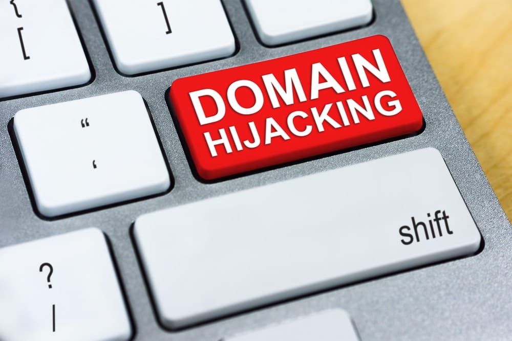 Keyboard with enter key that reads, 'DOMAIN HIJACKING'