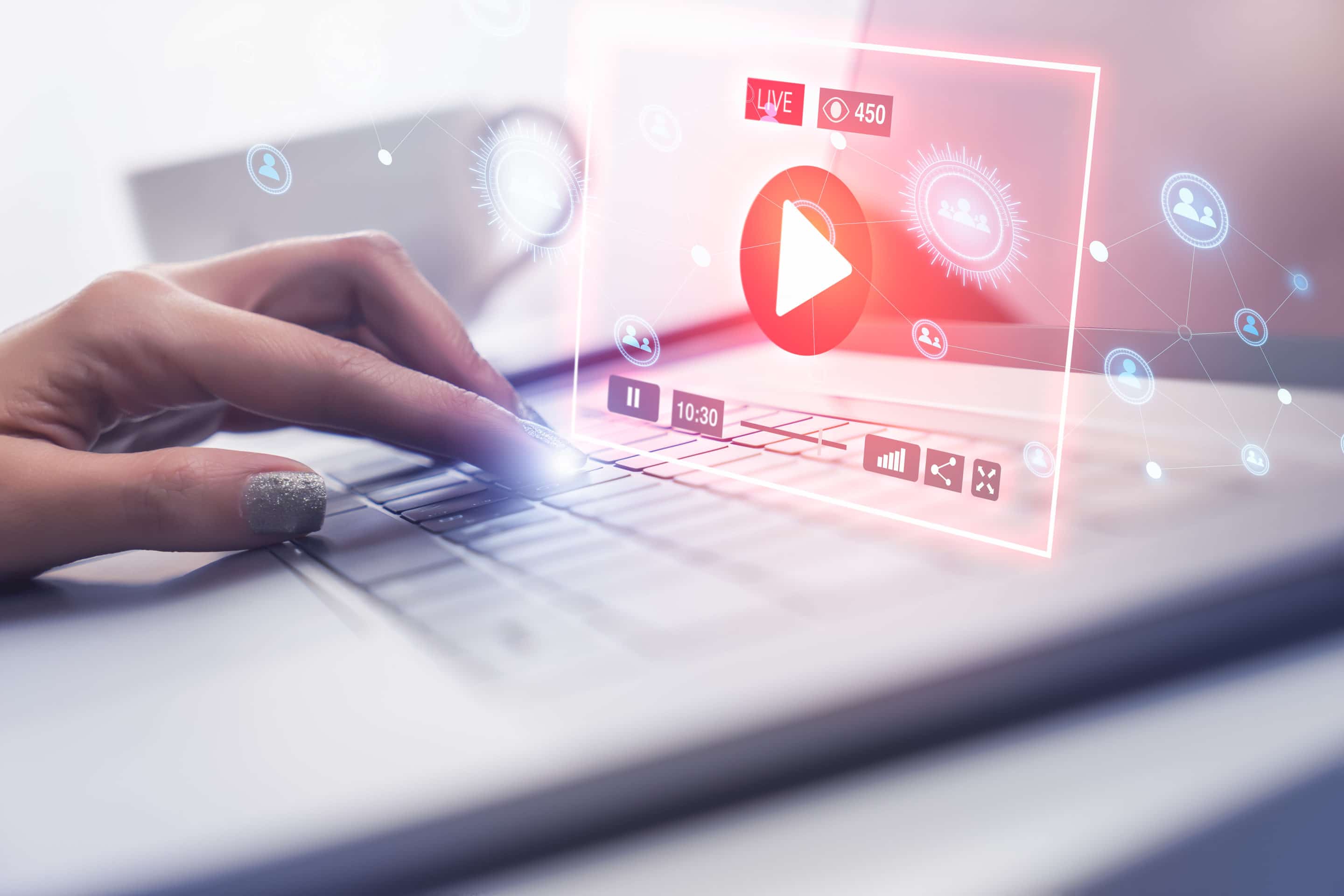 vpn_woman_streaming_video_content Woman streaming video content at home on laptop with a VPN.